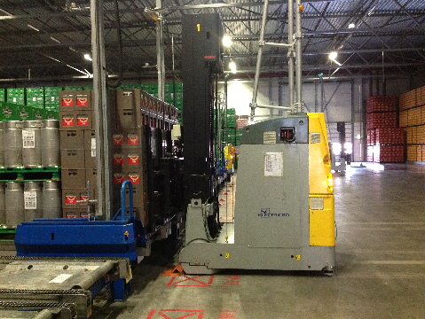 Laser Guided Vehicle Drops Off a Pair of Pallets at an Automatic Trailer Loading  System